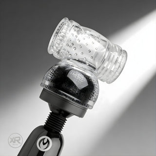 Clear textured sleeve attachment mounted on wand massager head, featuring internal ridges and nubs for enhanced sensation