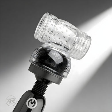 Clear textured sleeve attachment mounted on wand massager head, featuring internal ridges and nubs for enhanced sensation