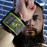 Tactical Wrist Cuff close-up on a raised fist showing the olive shield logo