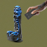 Tendril Thruster Blue tentacle dildo with the wireless remote in hand