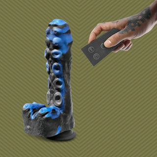 Tendril Thruster Blue tentacle dildo with the wireless remote in hand