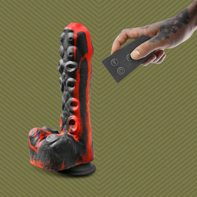 Tendril Thruster Red tentacle dildo with the wireless remote in hand
