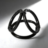 Black tri-cock-ring featuring three connected rings with flexible structure for enhanced comfort and fit
