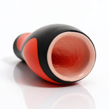 Close-up of the Vibra Head Bionic Auto Stroker opening showing the soft sleeve entrance and textured internal canal for enhanced stimulation