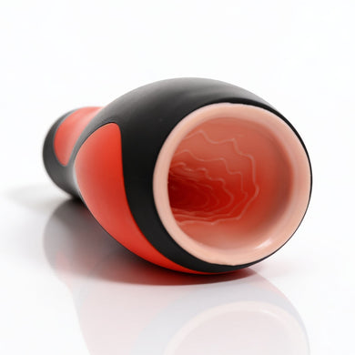 Close-up of the Vibra Head Bionic Auto Stroker opening showing the soft sleeve entrance and textured internal canal for enhanced stimulation