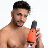 Male model holding the Vibra Head Bionic Auto Stroker to demonstrate its size, ergonomic shape, and easy-grip exterior