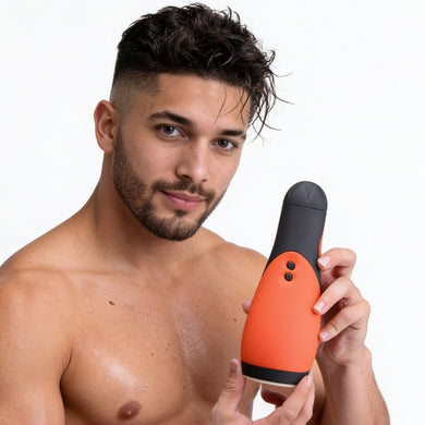 Male model holding the Vibra Head Bionic Auto Stroker to demonstrate its size, ergonomic shape, and easy-grip exterior